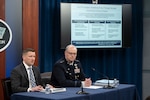 Jules W. Hurst III, left, performing the duties of the War Department comptroller, and Space Force Lt. Gen. Steven P. Whitney, Joint Staff director of force structure, resources and assessment, conduct a press briefing on the department's fiscal year 2027 budget proposal at the Pentagon, April 21, 2026.