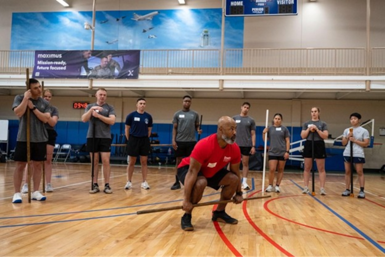 Chuck Carswell, CrossFit seminar trainer, instructs U.S. Space Force Guardians on proper deadlift technique during a Space Force CrossFit training seminar at the Rambler Fitness Center, Joint Base San Antonio–Randolph, April 3, 2026. Participants learned how to lead and program workouts using CrossFit methodology for their fellow Guardians.