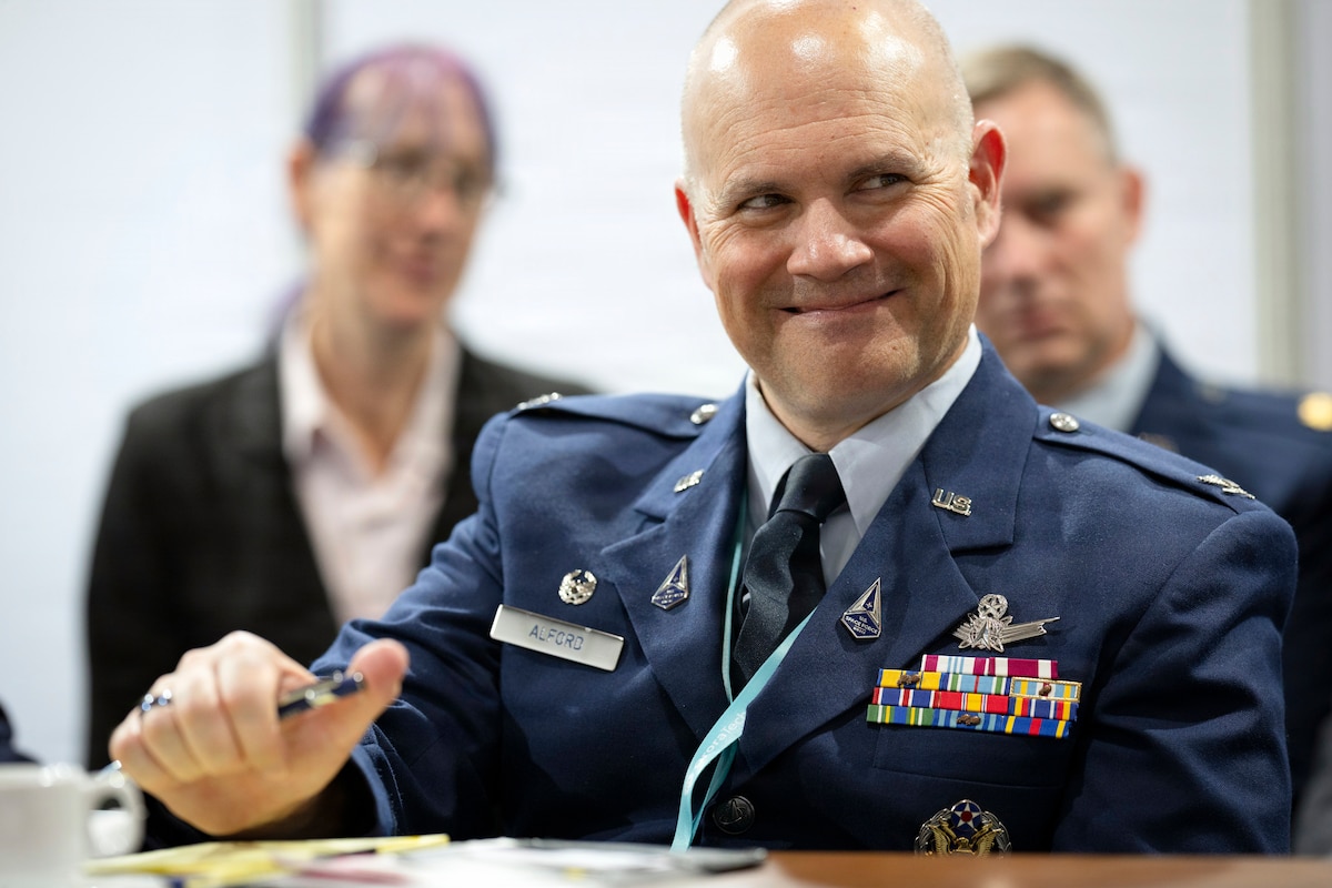 U.S. Space Force Col. Brandon Alford, U.S. Space Forces Southern commander smiles during a meeting with Chilean air force Space Director at the Feria Internacional del Aire y del Espacio (FIDAE) 2026 in Santiago, Chile, April 8, 2026. The trade show highlighted advances in air and space technology while encouraging collaboration across the global community. (U.S. Air Force photo by Tech. Sgt. Rachel Maxwell)