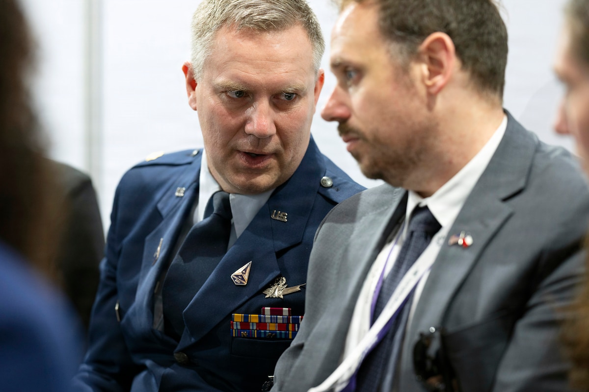 U.S. Space Force Maj. Travis Tubbs, international programs officer and science attaché, speaks with a member from the Secretary of the Air Force, International Affairs, during a meeting with Chilean air force Space Director at the Feria Internacional del Aire y del Espacio (FIDAE) 2026 in Santiago, Chile, April 8, 2026. Events like FIDAE support innovation and cooperation between the U.S. military and the international air and space industry. (U.S. Air Force photo by Tech. Sgt. Rachel Maxwell)