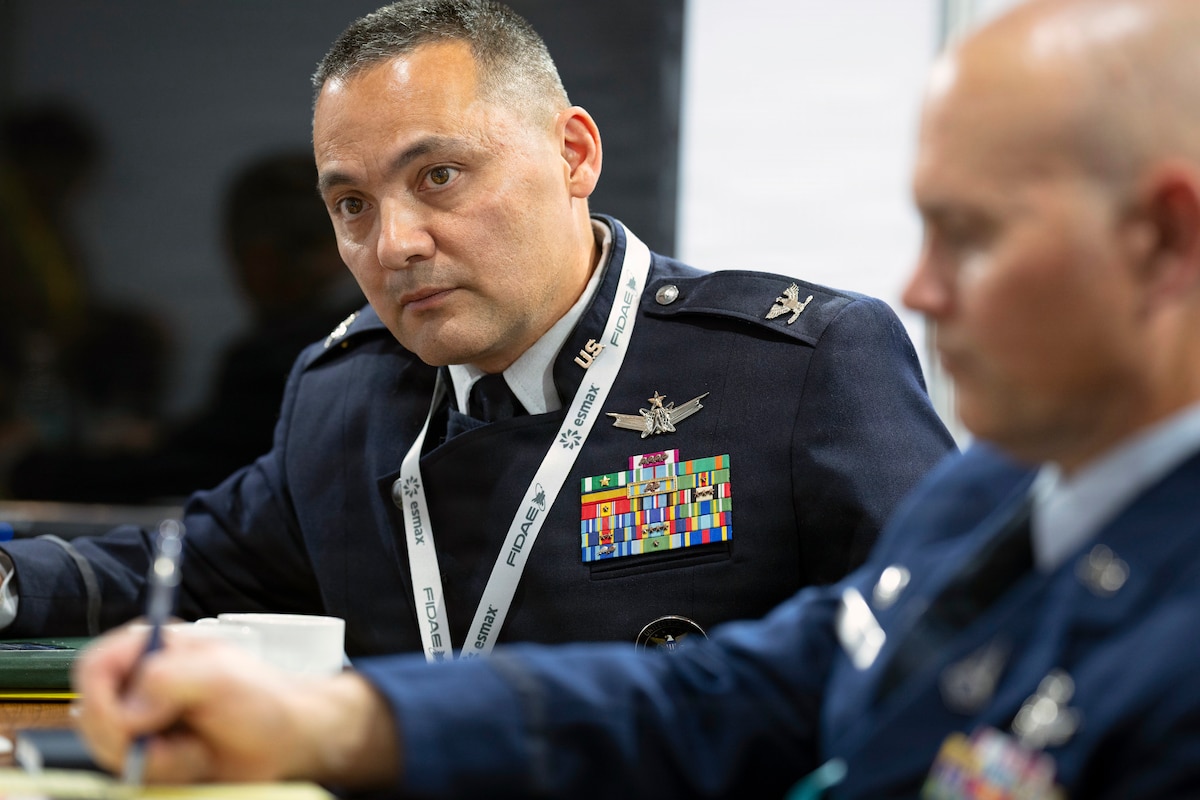 U.S. Space Force Col. John Kolb, U.S. Southern Command Joint Integrated Space Team director, listens during a meeting with Chilean air force Space Director at the Feria Internacional del Aire y del Espacio (FIDAE) 2026 in Santiago, Chile, April 8, 2026. Military engagement at FIDAE helps improve interoperability and cooperation between U.S. forces and regional partners. (U.S. Air Force photo by Tech. Sgt. Rachel Maxwell)