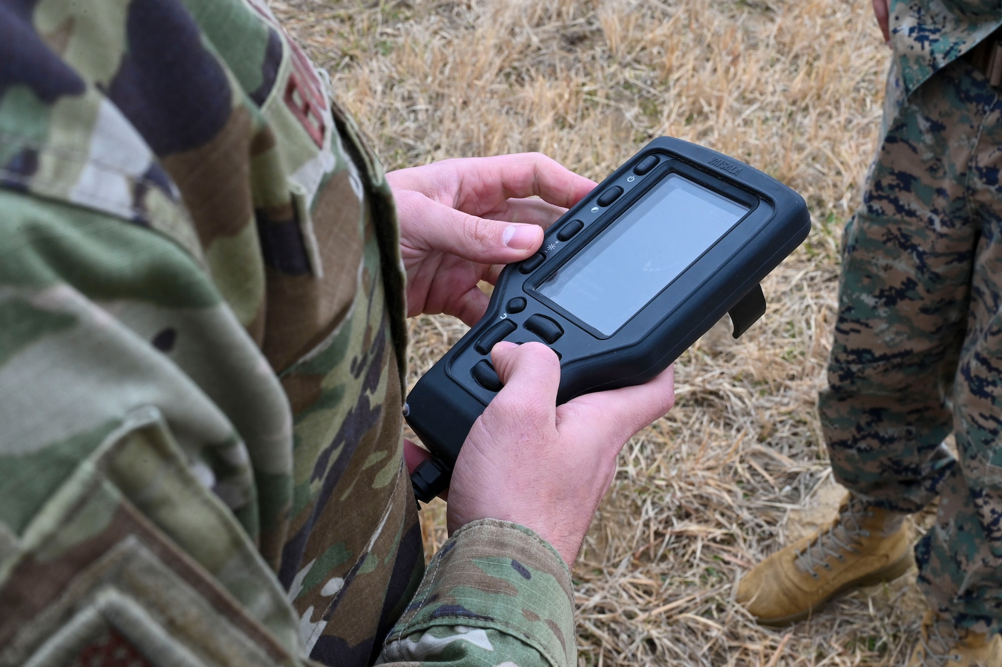 A man uses a control pad.
