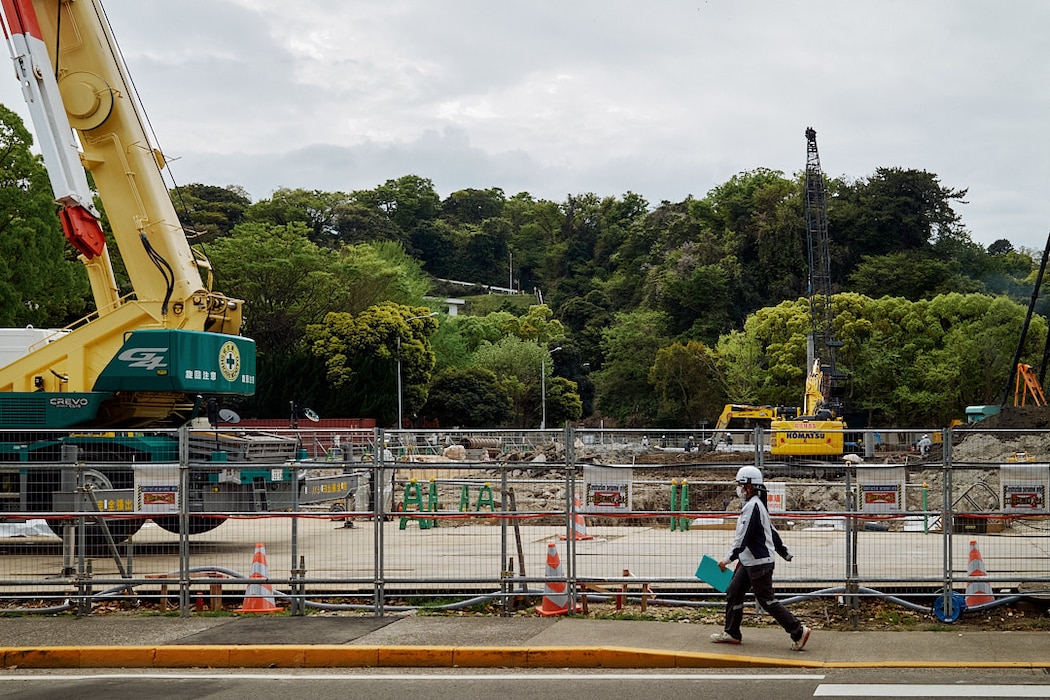 FLEET ACTIVITIES YOKOSUKA, Japan (April 15, 2026) -- Teams work on the early stages of foundation work April 15, 2026 at the site of NA1807, a multi-level steel parking structure designed to provide approximately 460 privately-owned vehicles serving the Kyuban and Jyuban Unaccompanied Housing (UH) Towers. The parking structure replaces a ground level paved parking lot is designed to continue serving UH tenants and staff while offering space available service for nearby facilities. (U.S. Navy photo by James Kimber)