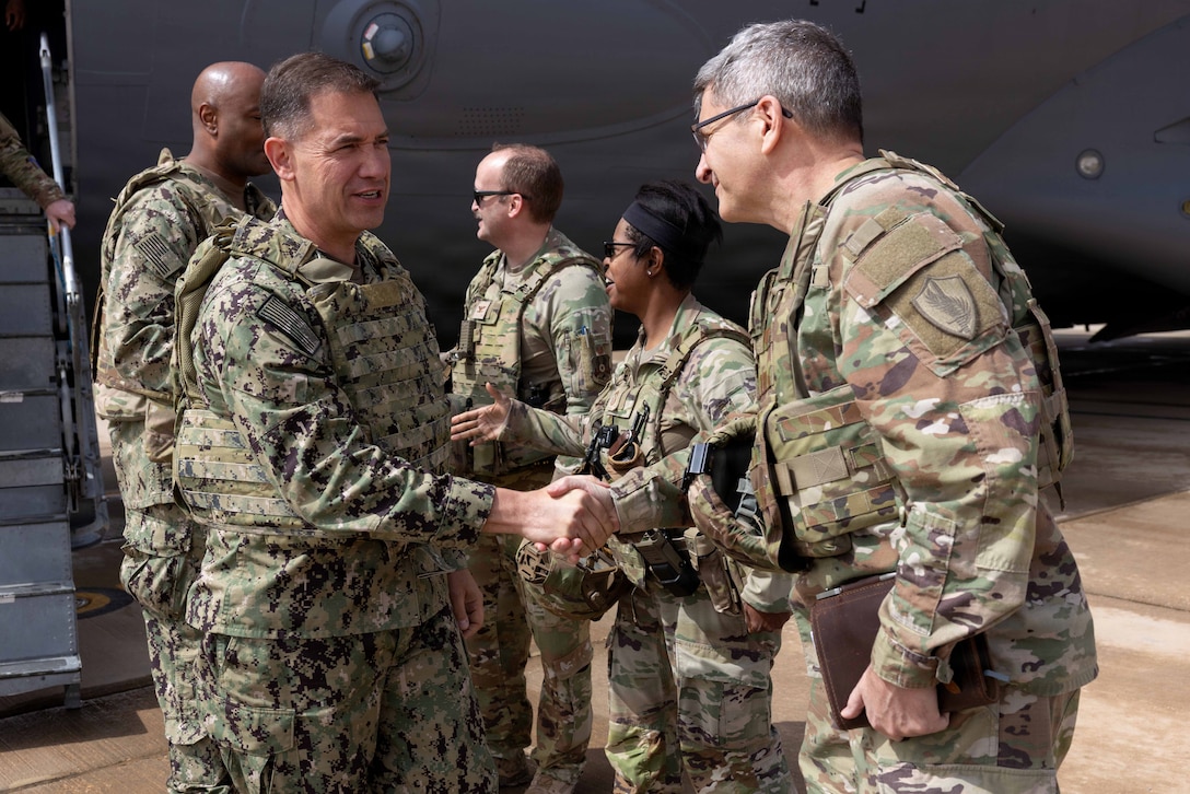 Army Brigadier General David Kobs, United States Senior Defense Official and Defense Attache to the Kingdom of Saudi Arabia (right) greets U.S. Navy Admiral Brad Cooper, commander of U.S. Central Command, before a troop engagement visit to a base in the Middle East. Cooper visited troops to answer questions and recognize their achievements in their continued efforts. (U.S. Navy photo by Senior Chief Mass Communication Specialist Amanda Dunford)