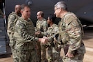Army Brigadier General David Kobs, United States Senior Defense Official and Defense Attache to the Kingdom of Saudi Arabia (right) greets U.S. Navy Admiral Brad Cooper, commander of U.S. Central Command, before a troop engagement visit to a base in the Middle East. Cooper visited troops to answer questions and recognize their achievements in their continued efforts. (U.S. Navy photo by Senior Chief Mass Communication Specialist Amanda Dunford)