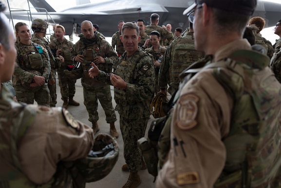 U.S. Navy Admiral Brad Cooper, commander of U.S. Central Command, engages with troops during an awards presentation at a base in the Middle East. Cooper visited troops to answer questions and recognize their achievements in their continued efforts. (U.S. Navy photo by Senior Chief Mass Communication Specialist Amanda Dunford)