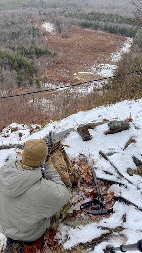 image of an Airman firing his rifle.