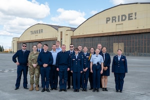U.S. Force Junior Reserve Officers' Training Corps students from Clarkston High School stand in front of the hangars at Fairchild Air Force Base, Washington.