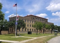 Naval Medical Forces Development Command headquarters building, located at Joint Base San Antonio-Fort Sam Houston, is shown, on Dec. 4, 2023. NMFDC is the headquarters element designated within the Bureau of Medicine and Surgery as a direct subordinate to the Surgeon General of the Navy, charged with leading and managing all medical training, education, professional development, and instruction to produce highly trained and ready medical personnel. (U.S. Navy photo by Mass Communication Specialist 1st Class David Kolmel)