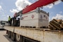 a large fuel tank for a generator sits on a flatbed truck.
