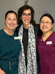 Mrs. Regina Kosiba (center), lead volunteer for the American Red Cross Dental Program, stands with dental assistant students Mrs. Anna Mendeola (left) and Mrs. Chloe Osada (right) during the Red Cross Dental Assistant Training Program at Tignor Dental Clinic on Joint Base Langley-Eustis, Virginia.