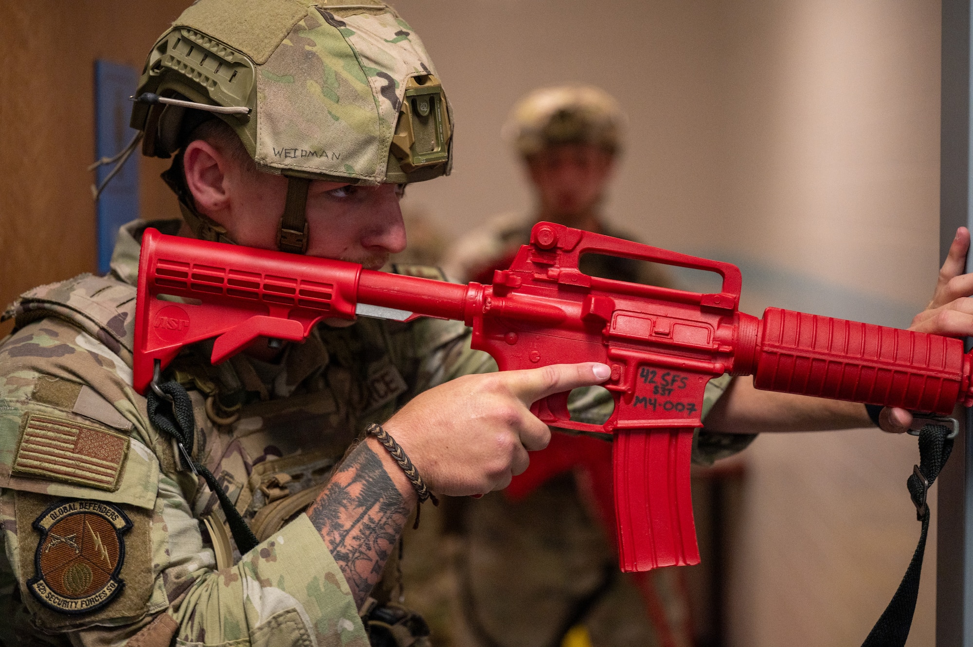 U.S. Air Force Airman 1st Class Ronald Weidman, 42d Security Forces Squadron entry controller, responds to a simulated active shooter situation at Maxwell Air Force Base, Alabama, April 15, 2026. The simulation was part of MAXFORCE 26-02, an exercise ran by the 42d Inspector General to test the responses of personnel at Maxwell. (U.S. Air Force photo by Staff Sgt. Evan Porter)