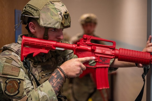 U.S. Air Force Airman 1st Class Ronald Weidman, 42d Security Forces Squadron entry controller, responds to a simulated active shooter situation at Maxwell Air Force Base, Alabama, April 15, 2026. The simulation was part of MAXFORCE 26-02, an exercise ran by the 42d Inspector General to test the responses of personnel at Maxwell. (U.S. Air Force photo by Staff Sgt. Evan Porter)