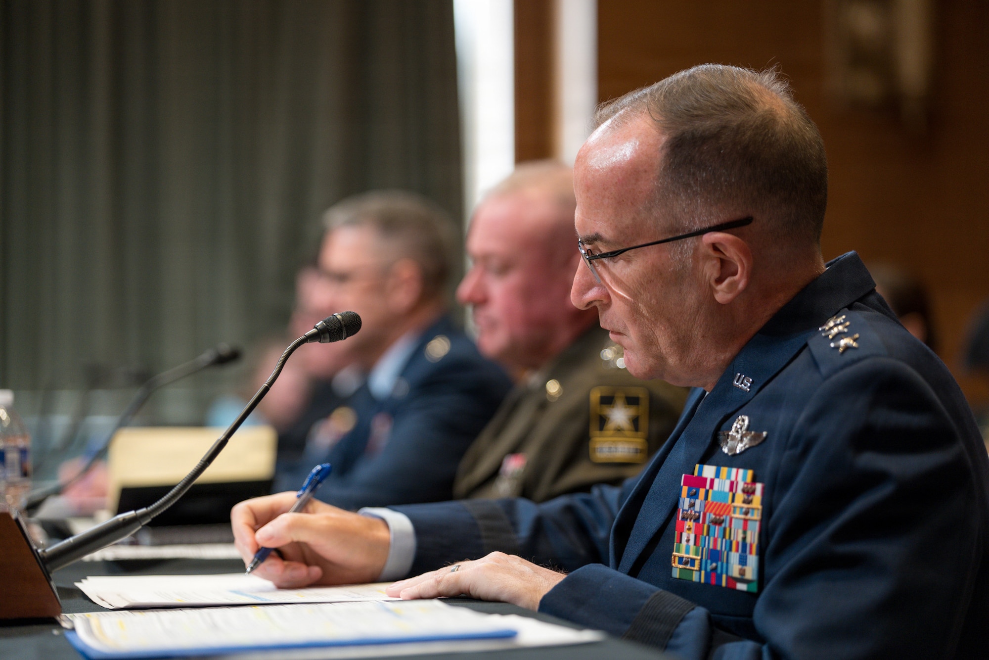 Lt Gen John Healy writes down notes