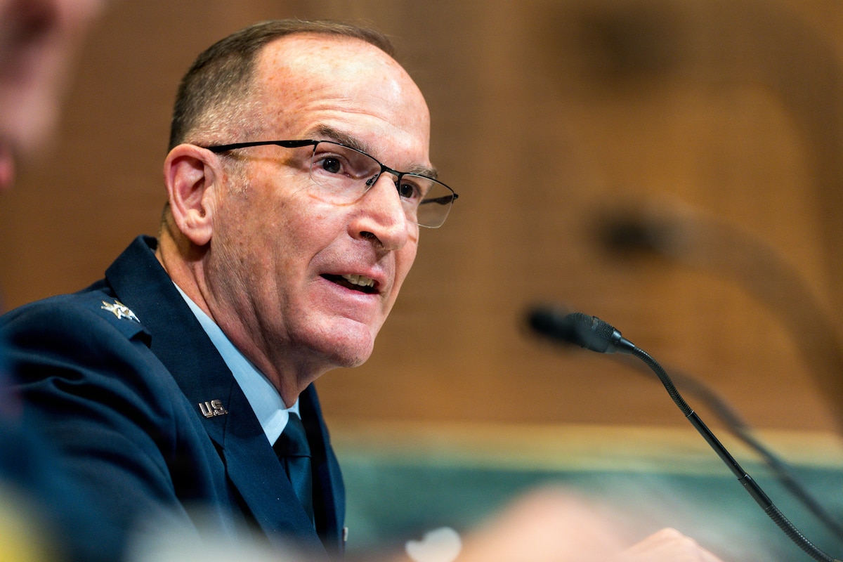 Lt Gen John Healy speaks into a microphone