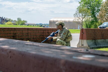 U.S. Air Force Airman 1st Class Eddy Thomas-Lopez, patrolman with the 11th Security Forces Squadron, scans the perimeter during a combat training exercise at Joint Base Anacostia-Bolling, Washington, D.C., April 14, 2026. The team demonstrated the readiness and preparedness of the squadron in combat environments. (U.S. Air Force photo by Senior Airman Shanel Toussaint)