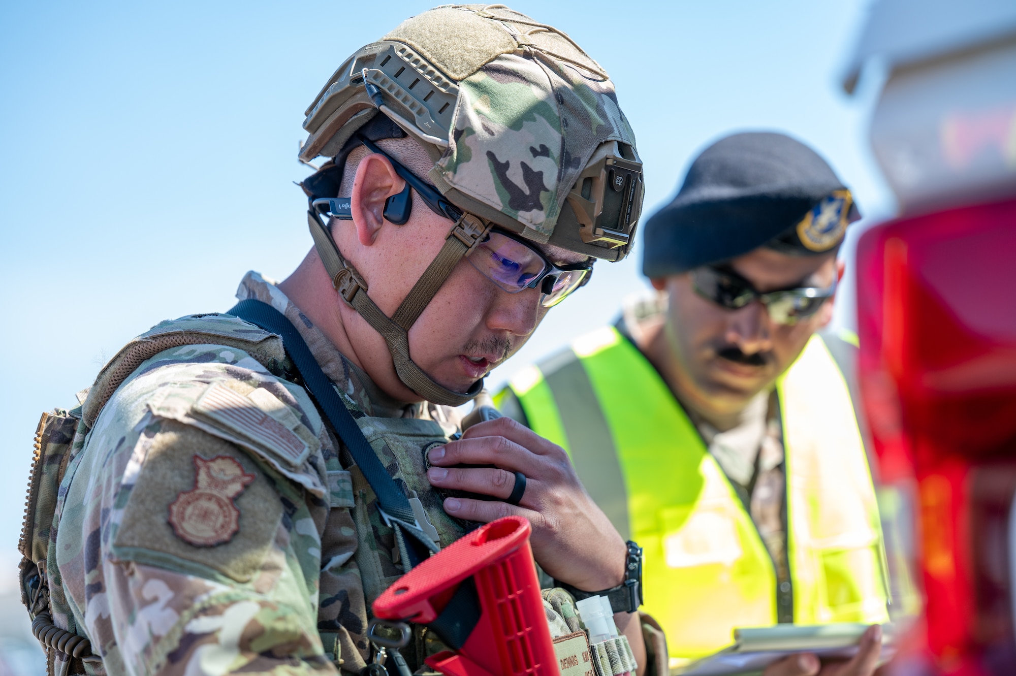 U.S. Air Force Tech Sgt. Dennis Kim, left, 42d Security Forces Squadron flight sergeant, and Master Sgt. Luis Apolinario, 42d Security Forces Squadron noncommissioned officer in charge of operations, inspect a map during MAXFORCE 26-02 at Maxwell Air force Base, Alabama, April 15, 2026. MAXFORCE 26-02 is a quarterly exercise designed to test the readiness and responses of base personnel to emergency situations. (U.S. Air Force photo by Staff Sgt. Evan Porter)