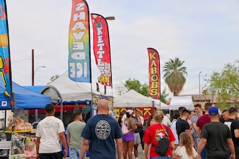 Service members and their families gather to enjoy the 29 Palms Farmers Market at Marine Corps Air Ground Combat Center (MCAGCC), April 9, 2026. The weekly event brings fresh produce, local vendors, and community engagement opportunities to the installation, supporting morale and quality of life. (U.S. Navy photo by Christopher Jones, NMRTC/NH Twentynine Palms public affairs officer)
