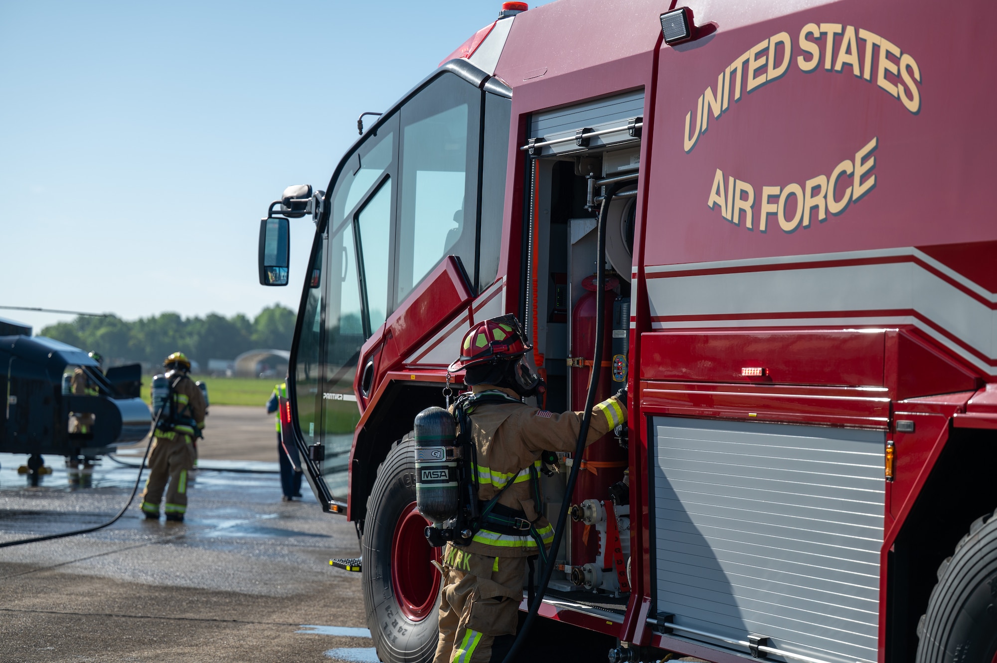 Firefighters assigned to the 42d Civil Engineer Squadron respond to a simulated downed aircraft at Maxwell Air Force Base, Alabama, April 16, 2026. The simulation was designed to test the response of emergency personnel at Maxwell. (U.S. Air Force photo by Staff Sgt. Evan Porter)