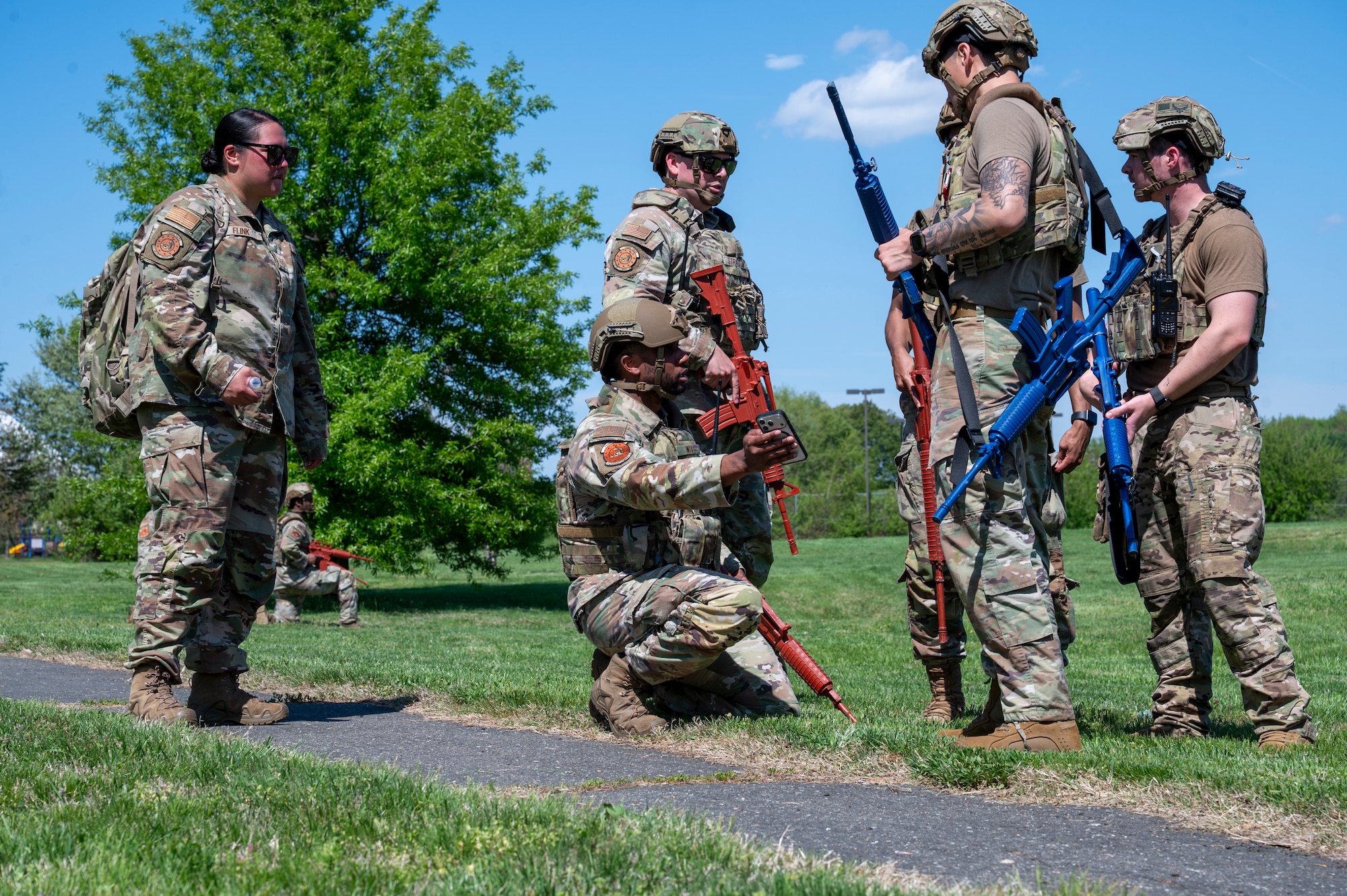 U.S. Air Force 11th Security Forces Squadron members communicate during a combat training exercise at Joint Base Anacostia-Bolling, Washington, D.C., April 14, 2026. The squadron demonstrated tactical readiness and effective combat response downrange. (U.S. Air Force photo by Senior Airman Shanel Toussaint)