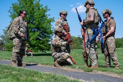 U.S. Air Force 11th Security Forces Squadron members communicate during a combat training exercise at Joint Base Anacostia-Bolling, Washington, D.C., April 14, 2026. The squadron demonstrated tactical readiness and effective combat response downrange. (U.S. Air Force photo by Senior Airman Shanel Toussaint)