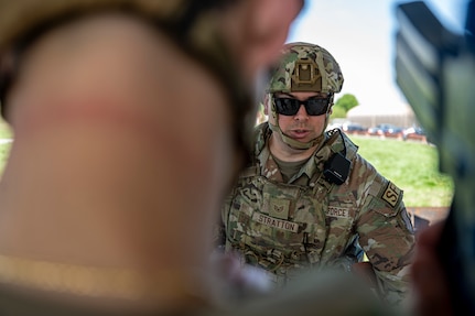 U.S. Air Force Staff Sgt. Timothy Stratton, flight sergeant with the 11th Security Forces Squadron, briefs defenders during a training exercise at Joint Base Anacostia-Bolling, Washington, D.C., April 14, 2026. The team practiced communication strategies and threat response to increase combat readiness for the squadron. (U.S. Air Force photo by Senior Airman Shanel Toussaint)