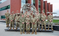 Chaplains from multiple U.S. Strategic Command component commands pose for a photo during a religious affairs readiness workshop at USSTRATCOM headquarters, on Offutt Air Force Base, April 15, 2026.