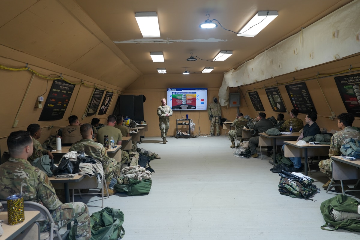 An Airman briefs students during training