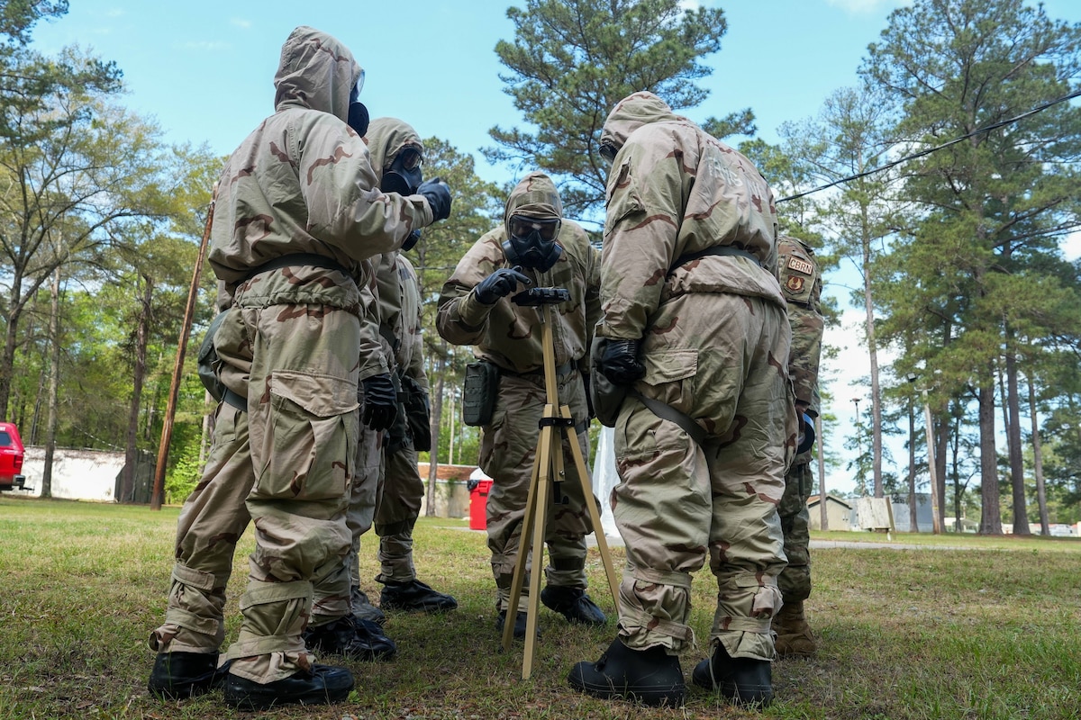 Airmen looking at M8 paper during training