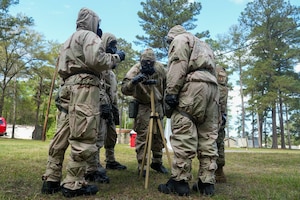 Airmen looking at M8 paper during training