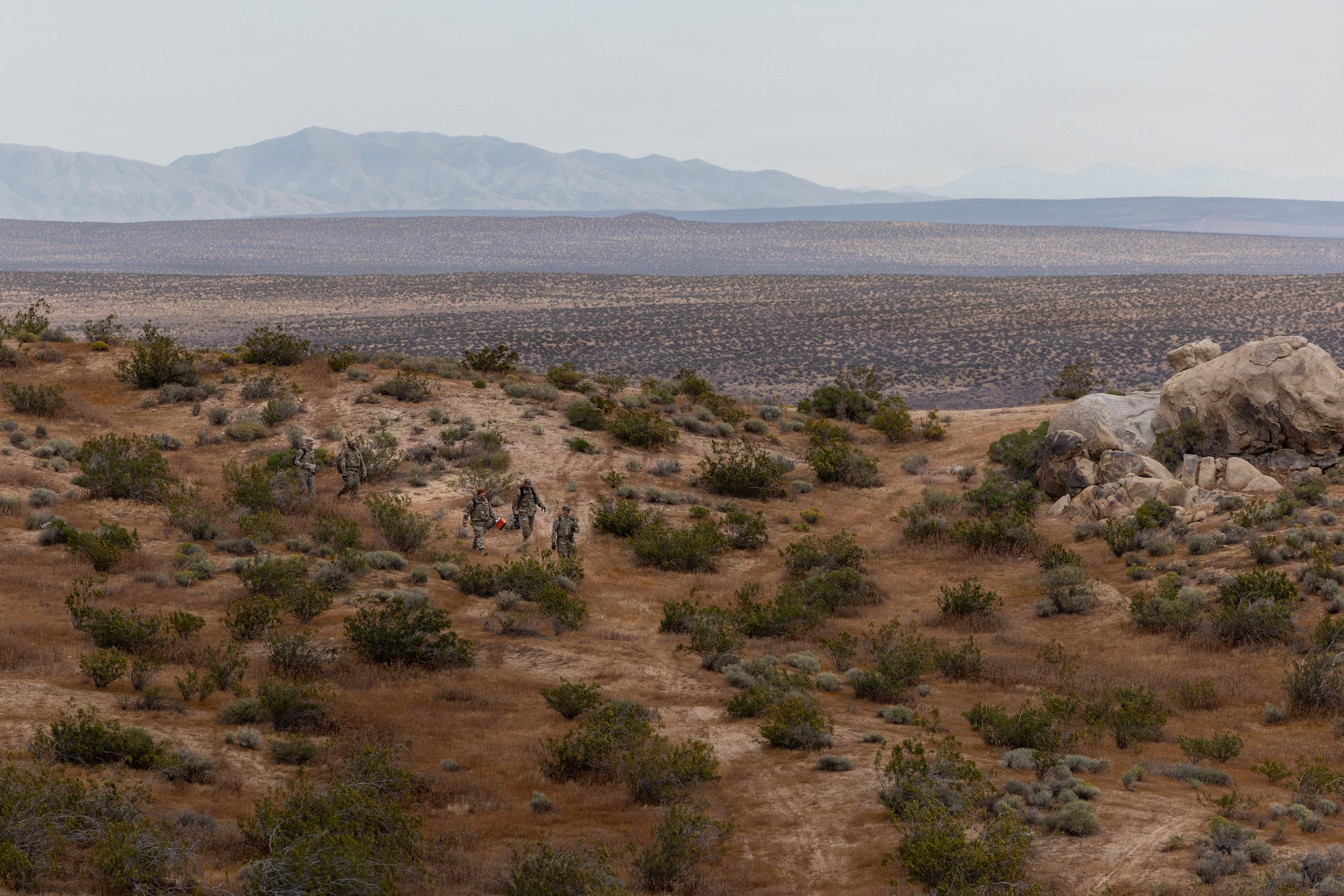 Airmen from 412th Maintenance Logistics Squadron team tackle the land navigation course during the annual Advanced Combat Training Exercise at Edwards Air Force Base, California, April 2, 2026. (Air Force photo by Ariana Ortega)