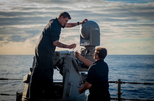 USS Hopper (DDG 70) Sailors Perform Maintenance on a shipboard weapons system in the Pacific Ocean
