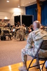 Chief MSgt. watches rehearsal.