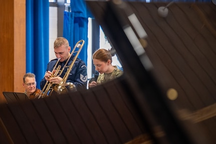 Man plays trombone.