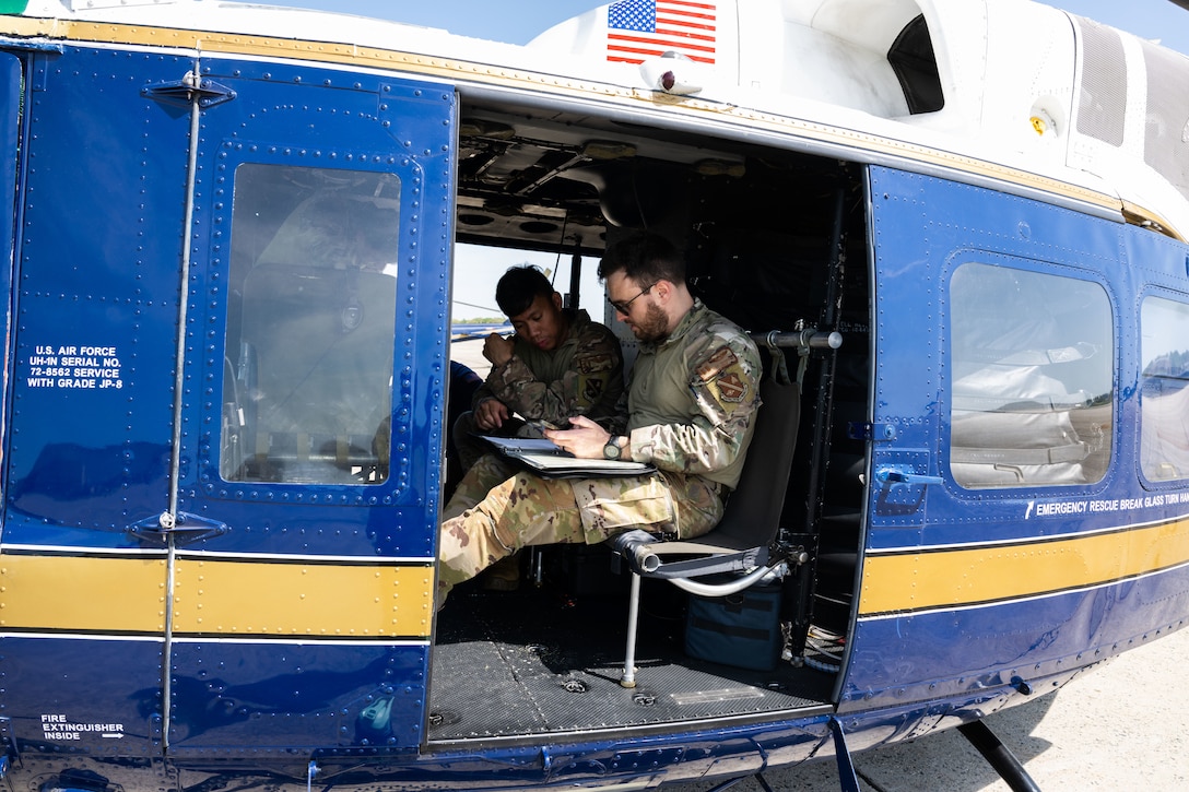 Two pilots sitting in a helicopter