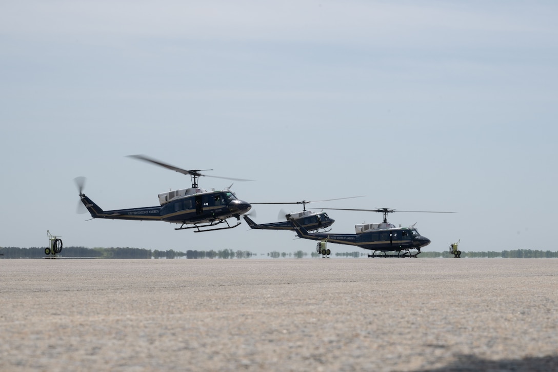 3 helicopters flying