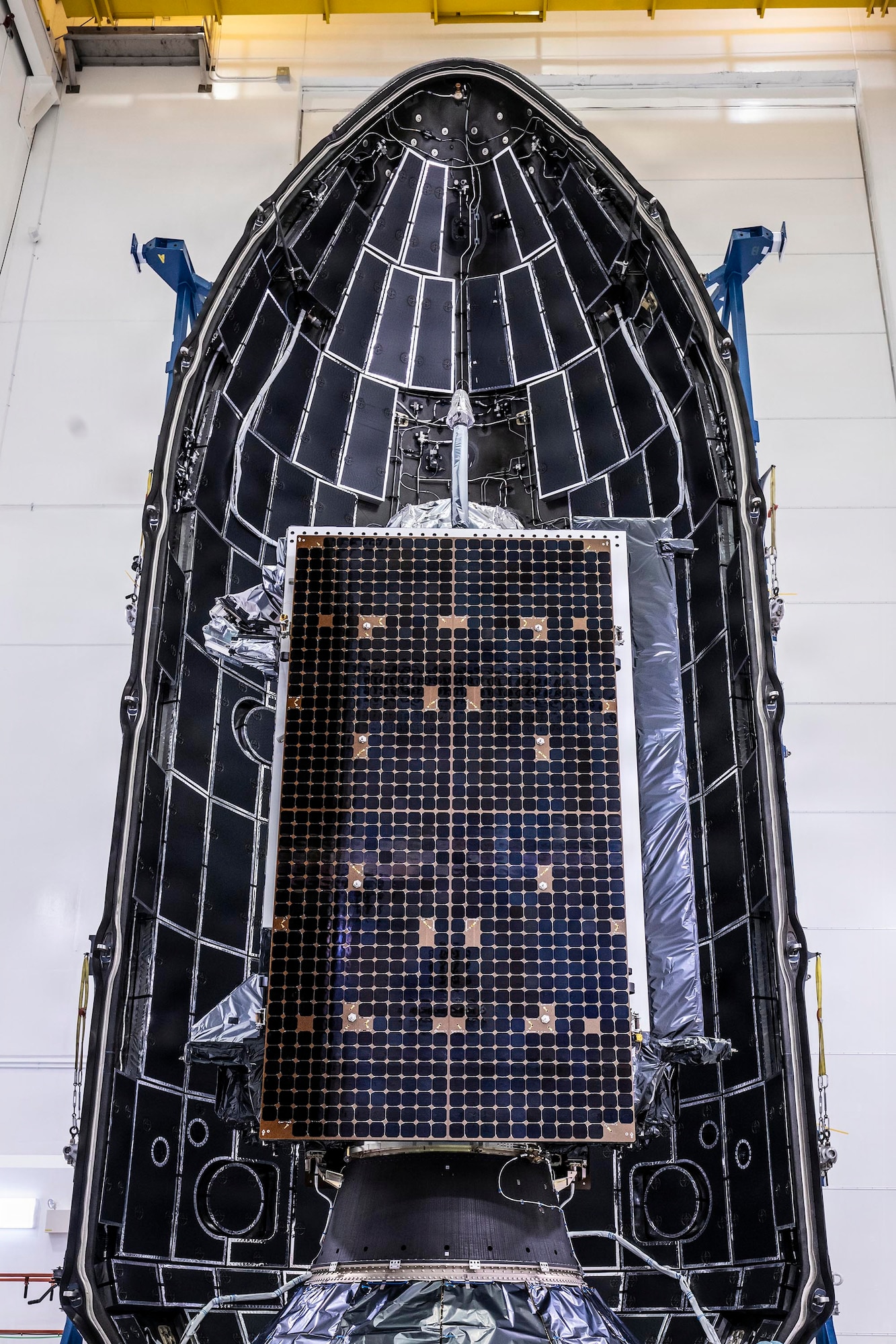 A Lockheed Martin Global Positioning System (GPS) III satellite is encapsulated into the fairings of a SpaceX Falcon 9 Rocket in preparation for the National Security Space Launch (NSSL) GPS III-8 mission, Cape Canaveral Space Force Station, Fla., April 15, 2026. This GPS III, known as Space Vehicle 10 (SV-10), is will complete the GPS III constellation, marking 32 active satellites in the constellation. SV-10 will provide the current constellation an additional satellite equipped with M-code technology, which provides GPS capabilities to the warfighter that are three-times more accurate and eight times more resistant to jamming than the previous constellation. Space Systems Command’s System Delta 80 (SYD 80), which manages the NSSL program for Space Access, worked in partnership with Combat Forces Command’s Mission Delta 31 (MD 31) to prepare for resilient and reliable launch to deliver this critical capability for the Nation. (Courtesy Photo by SpaceX)