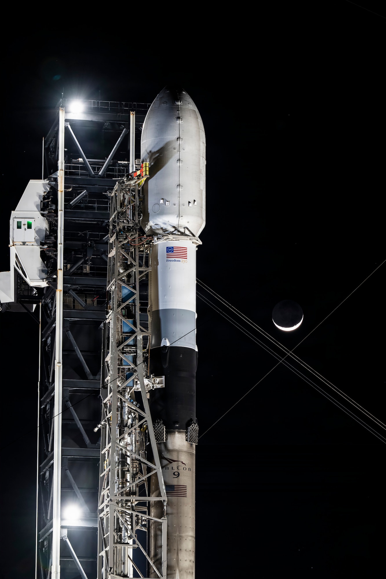 A SpaceX Falcon 9 rocket stands vertical ahead of the National Security Space Launch (NSSL) Global Positioning System (GPS) III-8 mission to deliver the final GPS III satellite, Space Vehicle 10 (SV-10) to medium Earth orbit (MEO) from Cape Canaveral Space Force Station, Fla., April 19, 2026. Space Systems Command’s System Delta 80 (SYD 80), which manages the NSSL program for Space Access, worked in partnership with Combat Forces Command’s Mission Delta 31 (MD 31) to prepare for resilient and reliable launch of the final GPS III satellite for the constellation to ensure GPS capabilities to the warfighter are three-times more accurate and eight times more resilient. (Courtesy Photo by SpaceX)