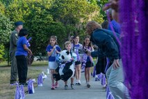Children walk to school and celebrate Month of the Military Child.