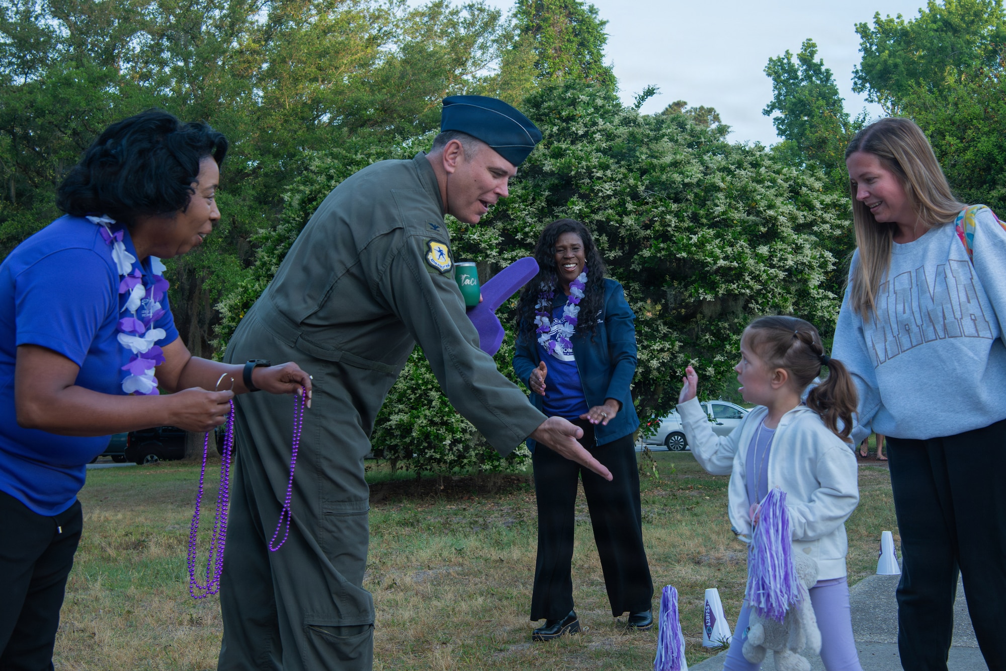 Base Leadership gives a high five in support Purple Day.