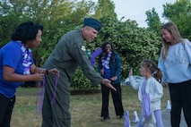 Base Leadership gives a high five in support Purple Day.