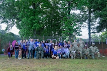 Joint base community poses for a group photo.