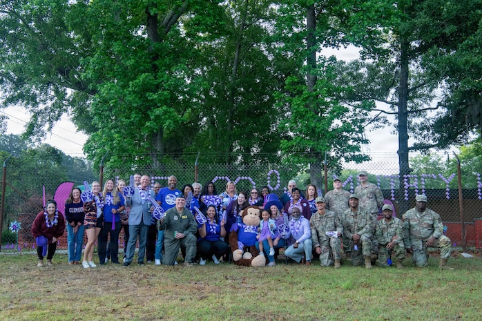 Joint base community poses for a group photo.