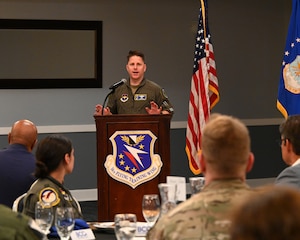 Commander of the 14th Flying Training Wing addresses the community and base personnel during a BCC luncheon.