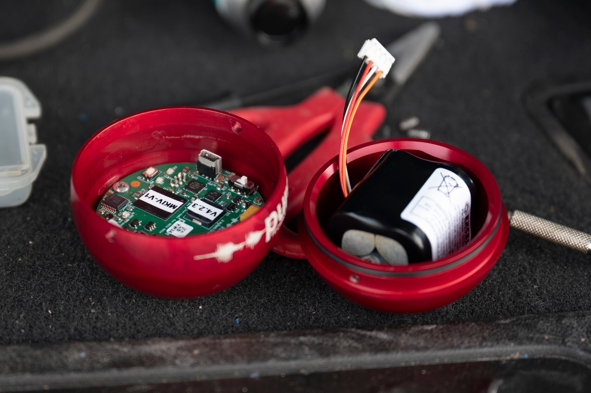 Contractors insert a device into a pipe.