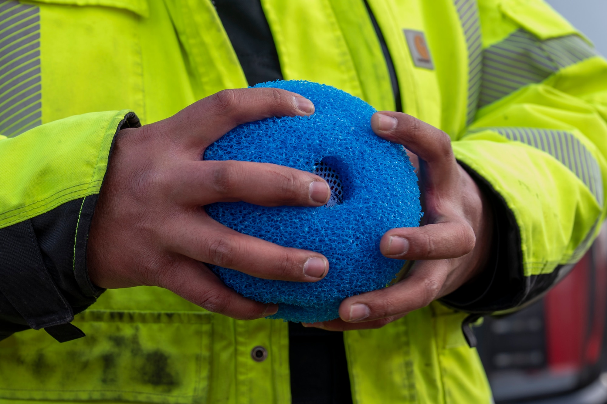 Contractors insert a device into a pipe.