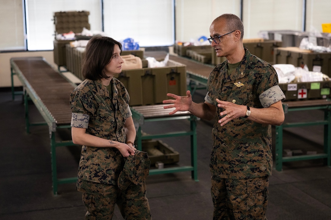 U.S. Navy Lt. AnnaLee Grant, medical materiel officer in charge at Blount Island Command, discusses prepositioned medical materiel with U.S. Navy Rear Adm. Guido Valdes, the Medical Officer of the Marine Corps, during a tour April 22, 2026, at Marine Corps Support Facility Blount Island, Florida. The Marine Corps’ senior medical advisor and health services director visited Blount Island Command to gain ground-level insight into prepositioned medical capabilities supporting global operations. (Marine Corps photo by Dustin Senger)