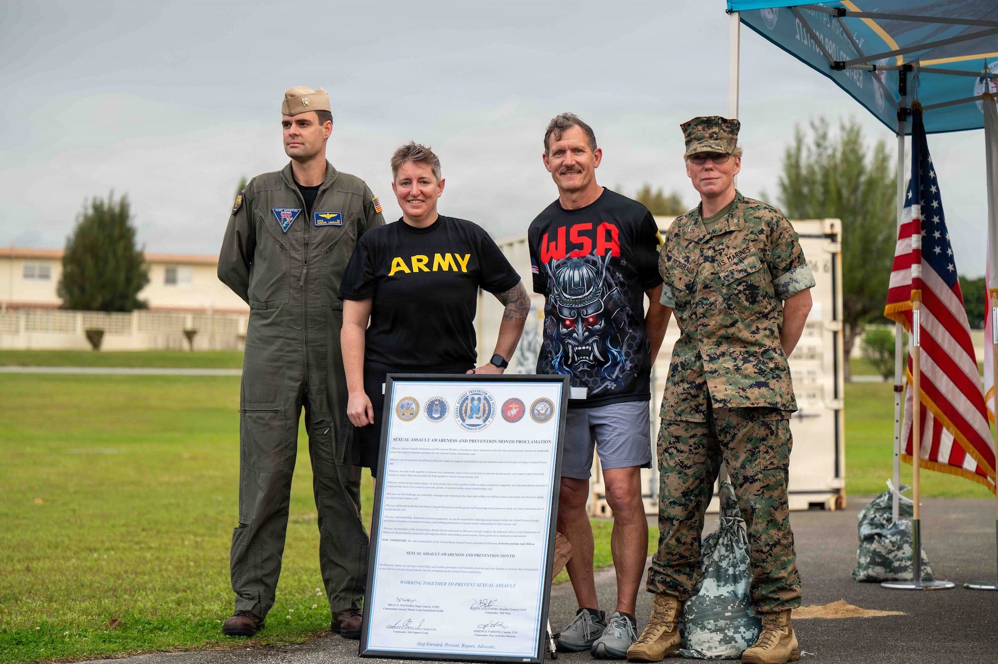 Service members pose for photo.