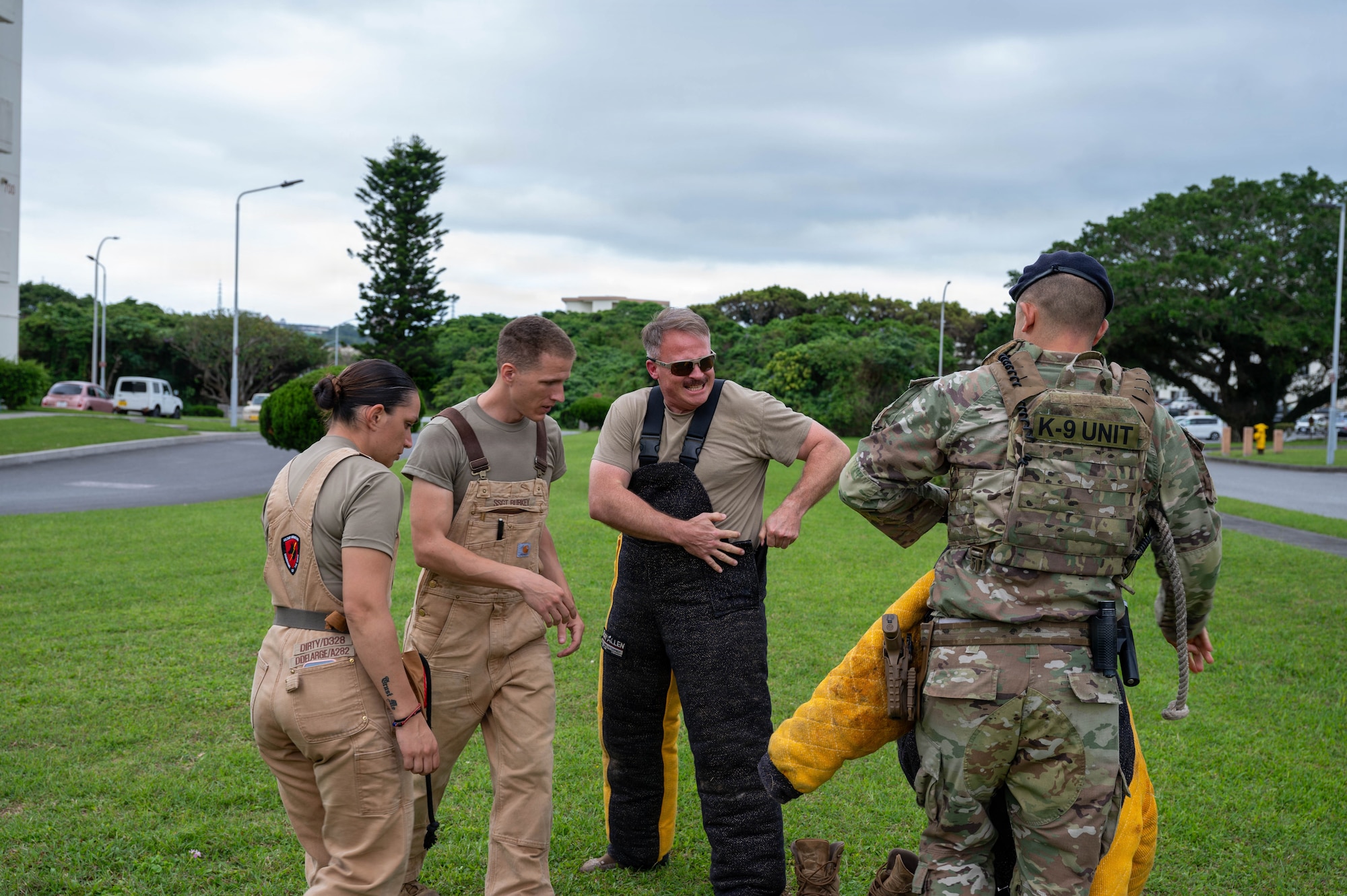 Service member dons bite suit.