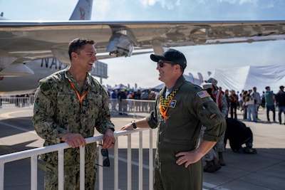 U.S. Navy Lt. Dmitriy Chekmenov, Patrol Squadron Thirty’s Maintenance Material Control Officer, left, talks to U.S. Air Force Lt. Col. Jeff Buddis, Air Boss, during Feria Internacional del Aire y del Espacio (FIDAE) 2026 in Santiago, Chile, April 7, 2026. As the United States approaches its 250th anniversary in 2026, participation in events like FIDAE highlights a long tradition of partnership and cooperation with allies and partners around the world. (U.S. Air Force photo by Andrea Jenkins)